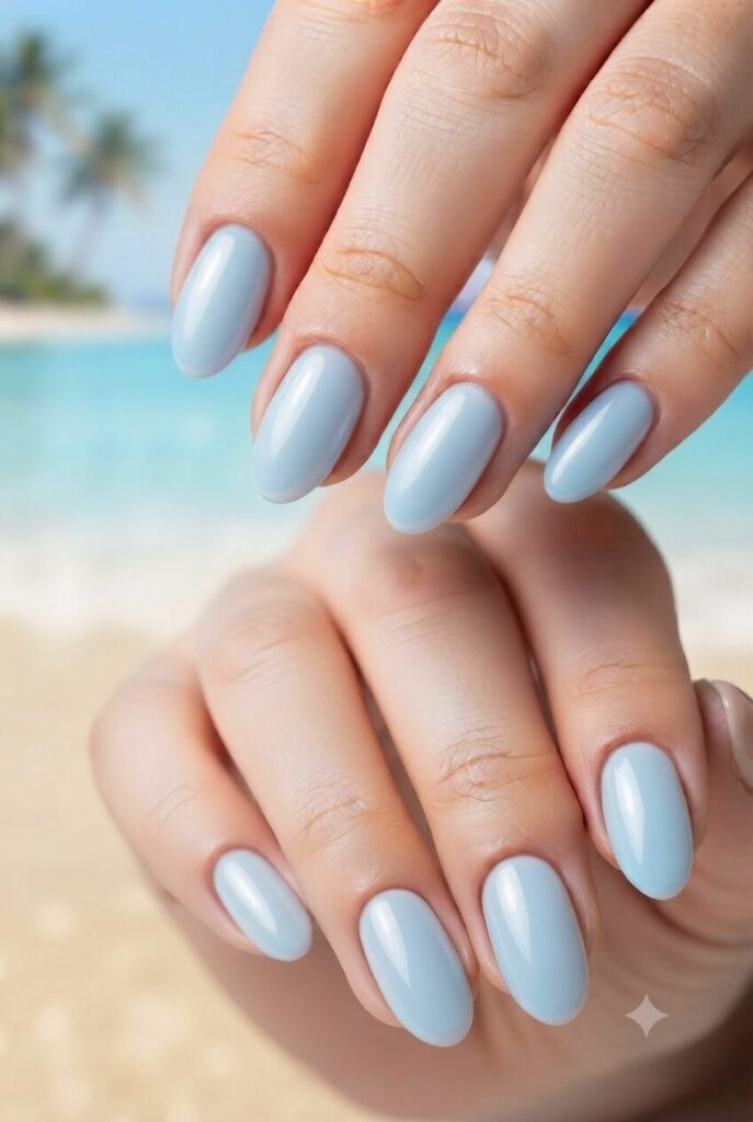 Short oval nails with soft sky blue glazed glossy polish