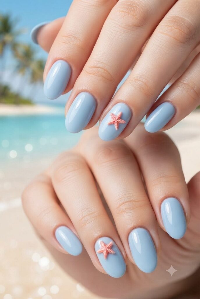 Short oval nails with blue base and tiny coral pink accents