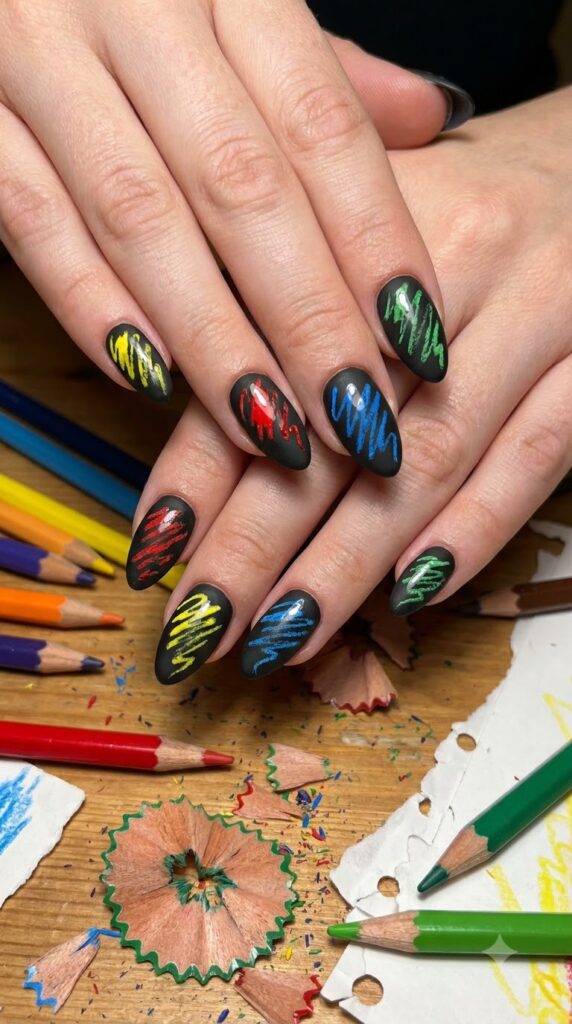 Matte black nails with bright crayon art scribbles