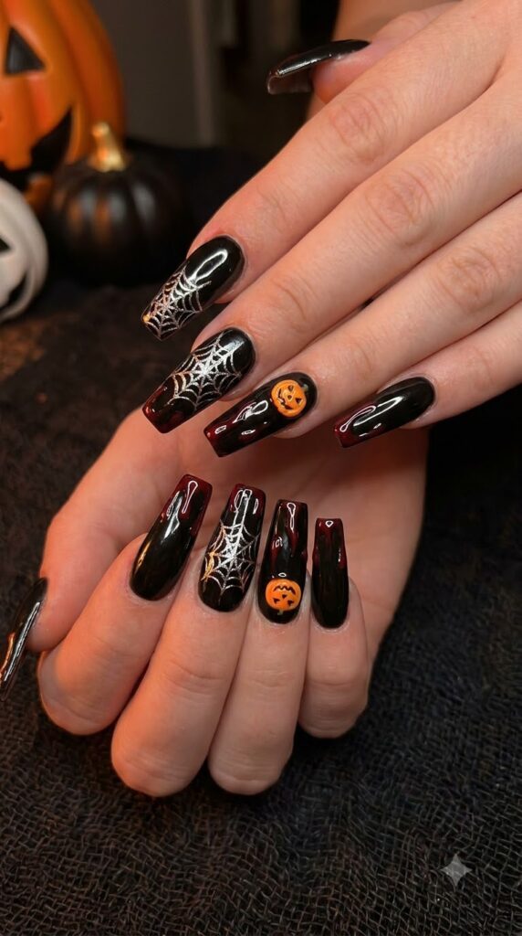Long black coffin nails with silver webs and dripping red blood