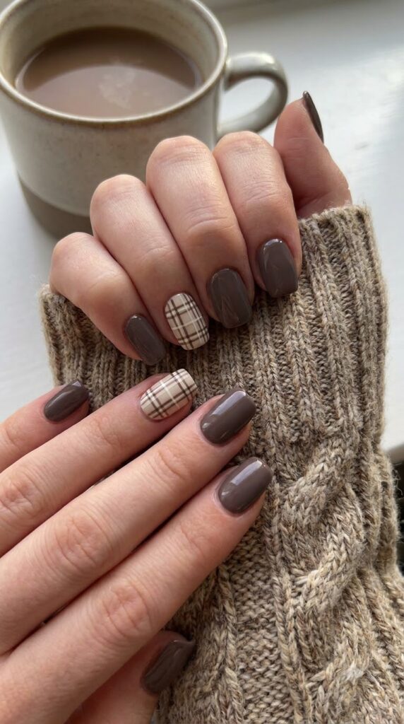 Squoval nails with taupe polish and cream brown plaid accent art