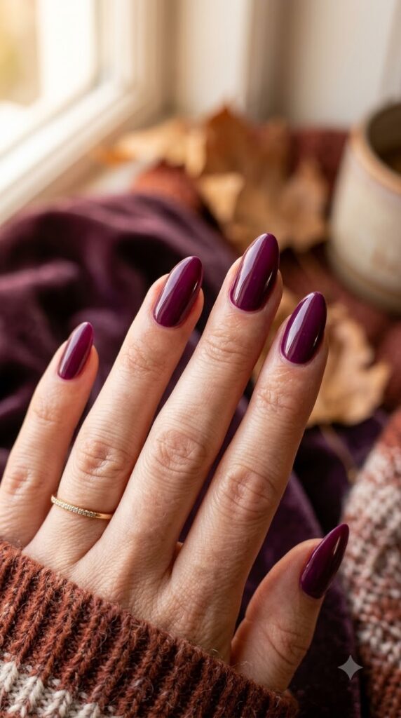 Deep berry purple nails for a dramatic late September style