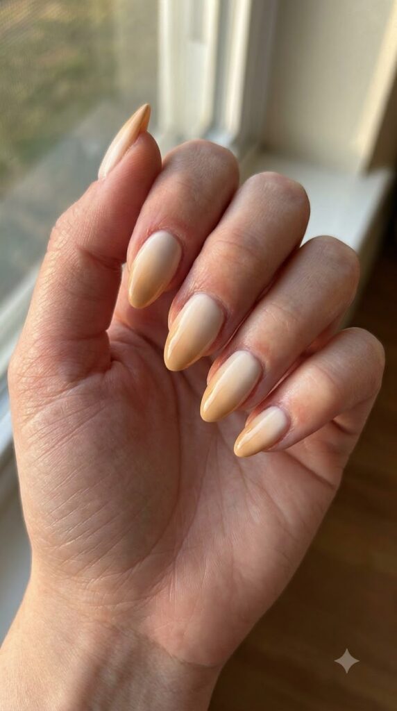 Almond nails with soft cream to honey beige ombre gradient