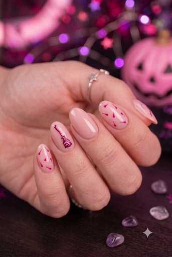 Short almond nails with nude pink base and tiny darker pink broomstick accents