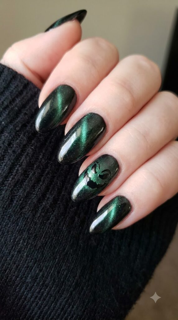 Medium almond black cat-eye velvet nails with green shimmer and Oogie smirk