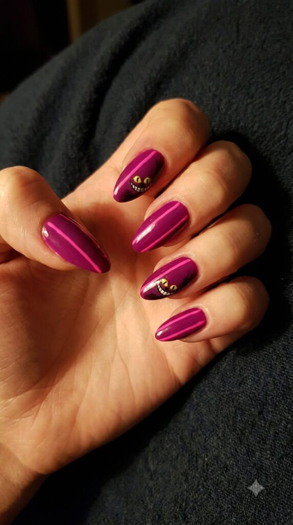 Almond magenta purple nails with Cheshire Cat stripes and yellow smile
