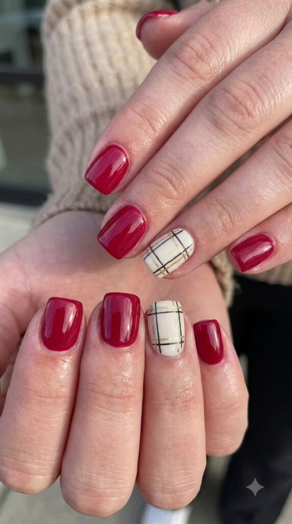 Short square cranberry red nails with cream black gold plaid accent art