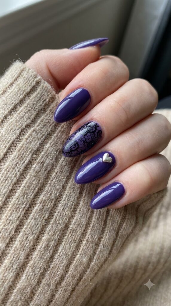 Almond deep violet nails with black lace pattern and 3D silver heart charm