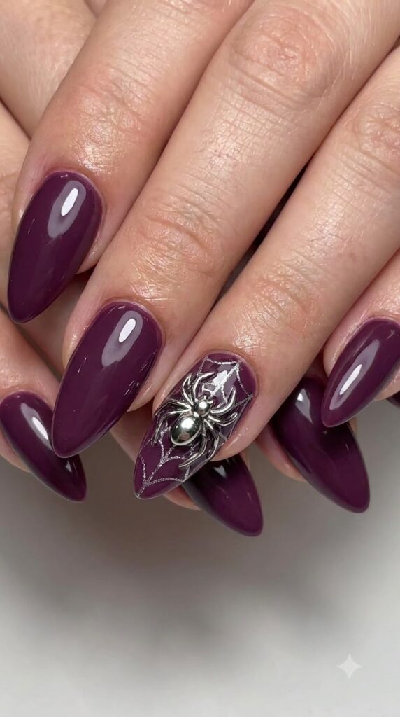 Stiletto dark mulberry purple nails with metallic silver chrome spider art