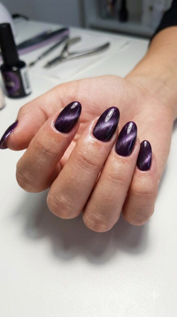 Medium almond nails with deep eggplant purple magnetic cat-eye velvet polish