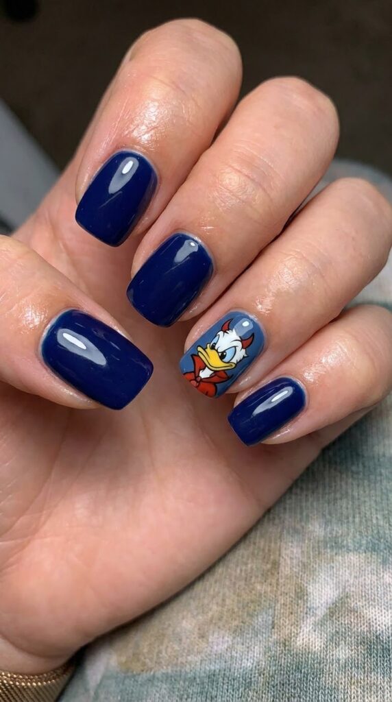 Short square navy blue nails with Donald Duck in a red devil cape