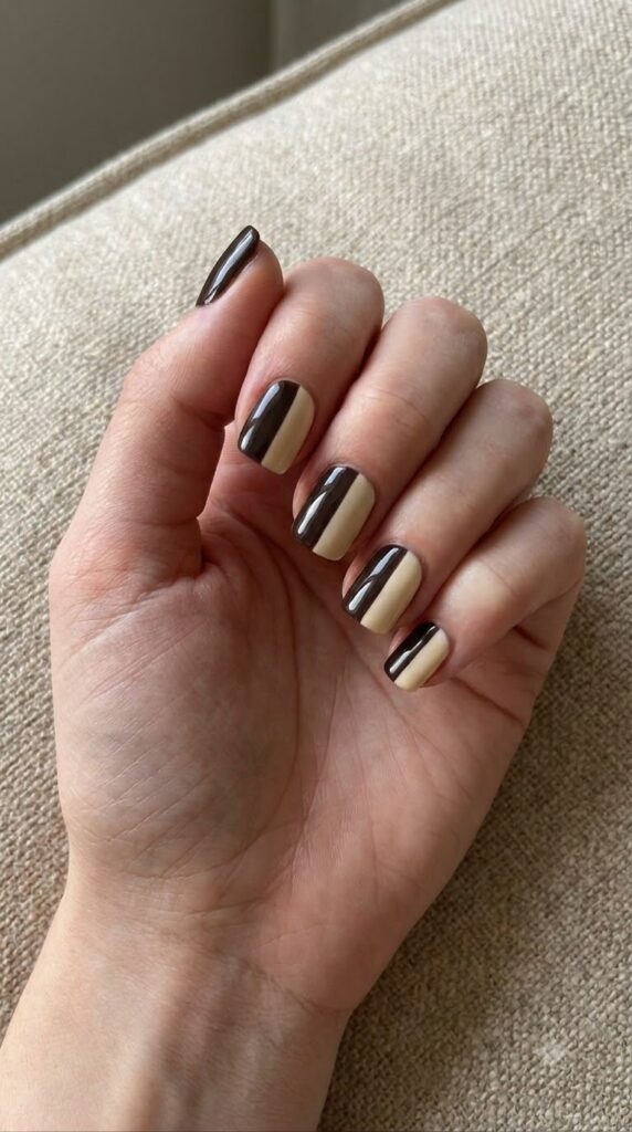 Short square nails split vertically with espresso brown and cream polish