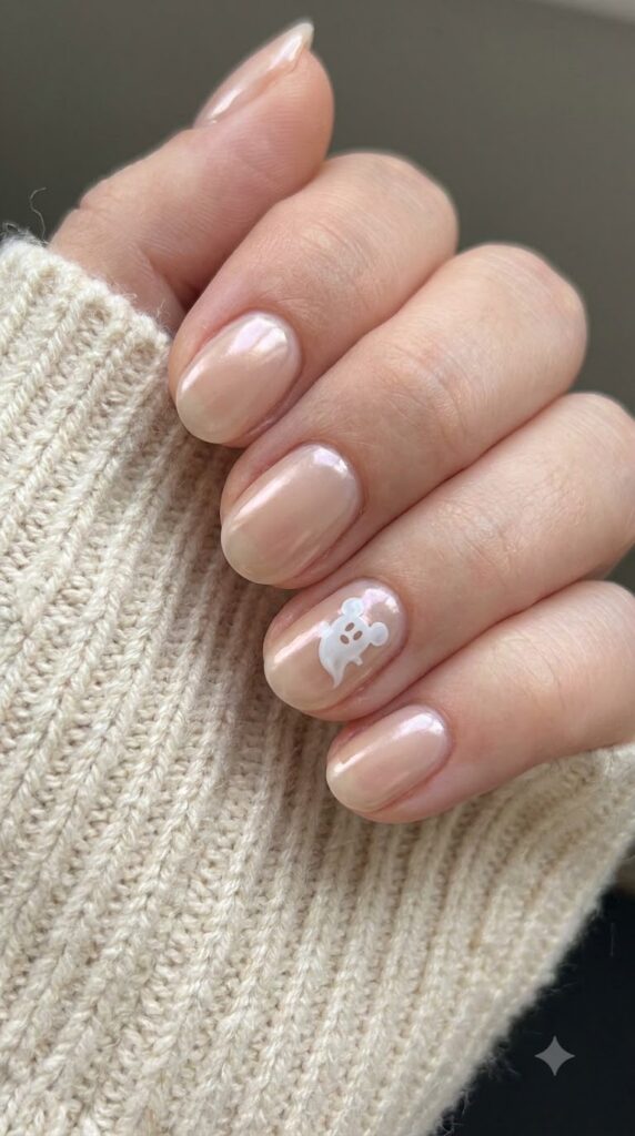 Natural round nude glazed nails with floating white Mickey ghost art