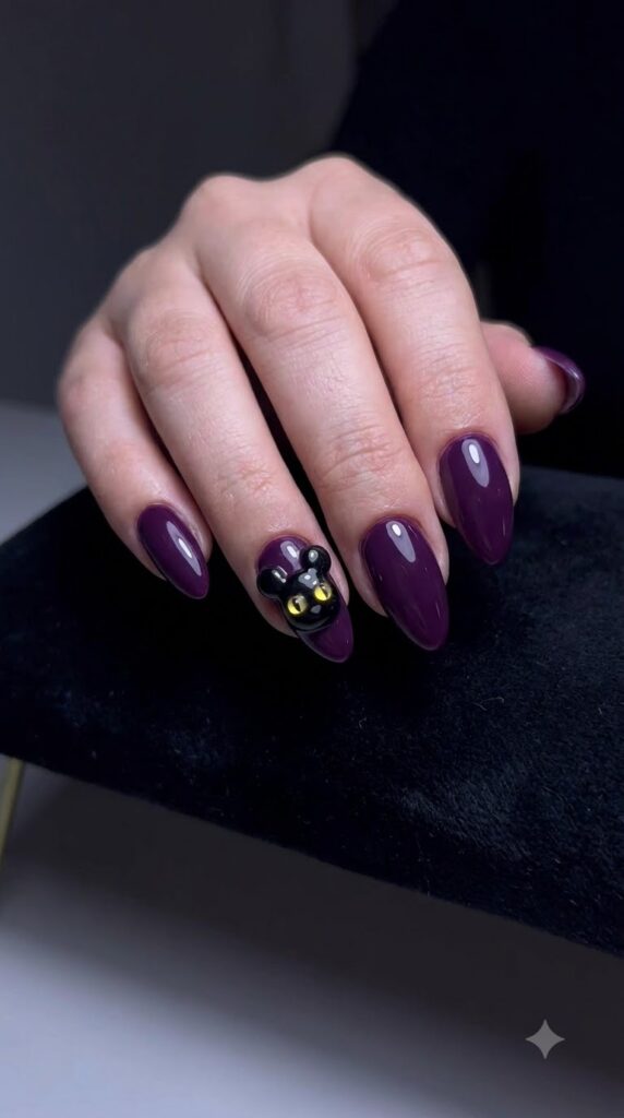 Almond deep purple nails with black Mickey cat ears and yellow eyes