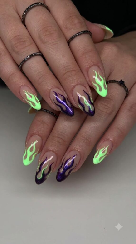 Long almond nude nails with swirling neon green and purple flames