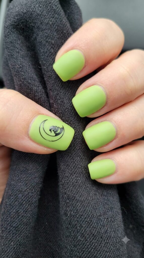 Short square matte lime green nails with black crescent moon and Oogie shadow