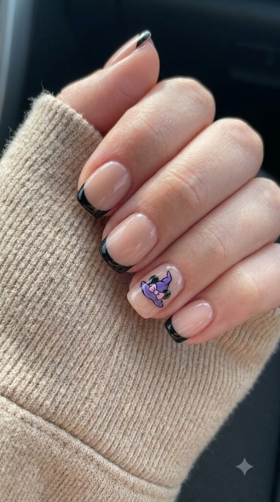 Short squoval nude nails with black French tips and purple Minnie witch hat