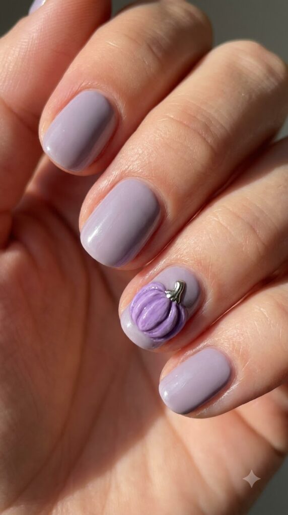 Short natural round lavender nails with 3D purple pumpkin accent art