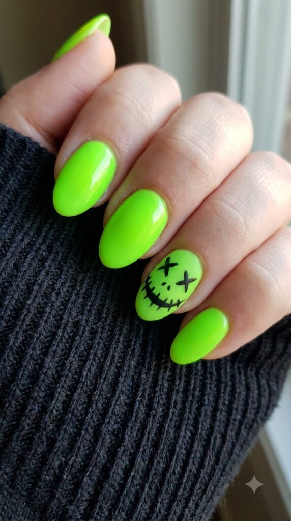 Short almond neon lime green nails with black stitched Oogie Boogie face art