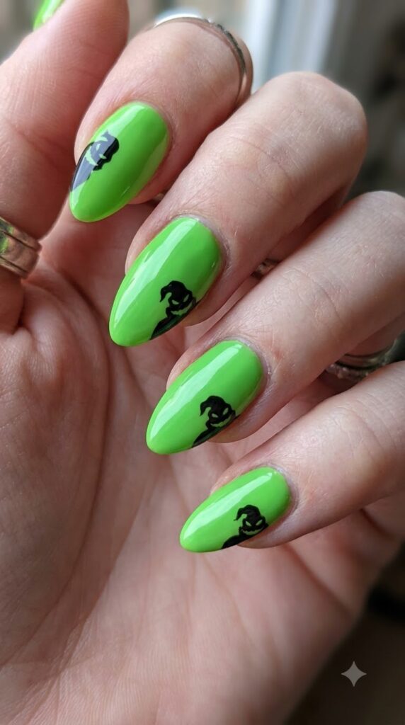 Almond lime green nails with black Oogie shadow faces lurking along edges