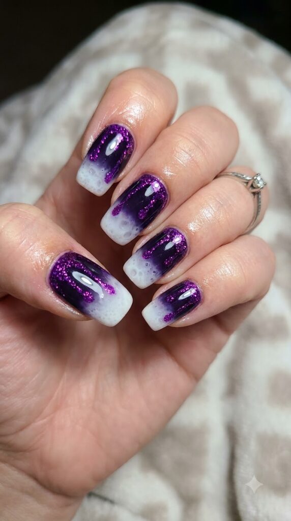 Squoval dark purple nails with white potion bubbles and purple glitter drips