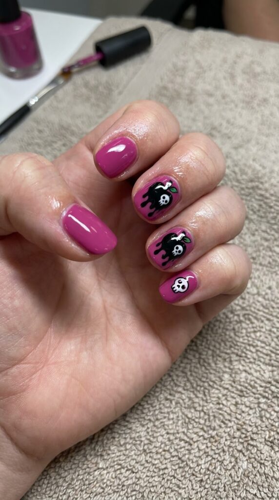 Short round magenta pink nails with glossy black dripping poison apple art