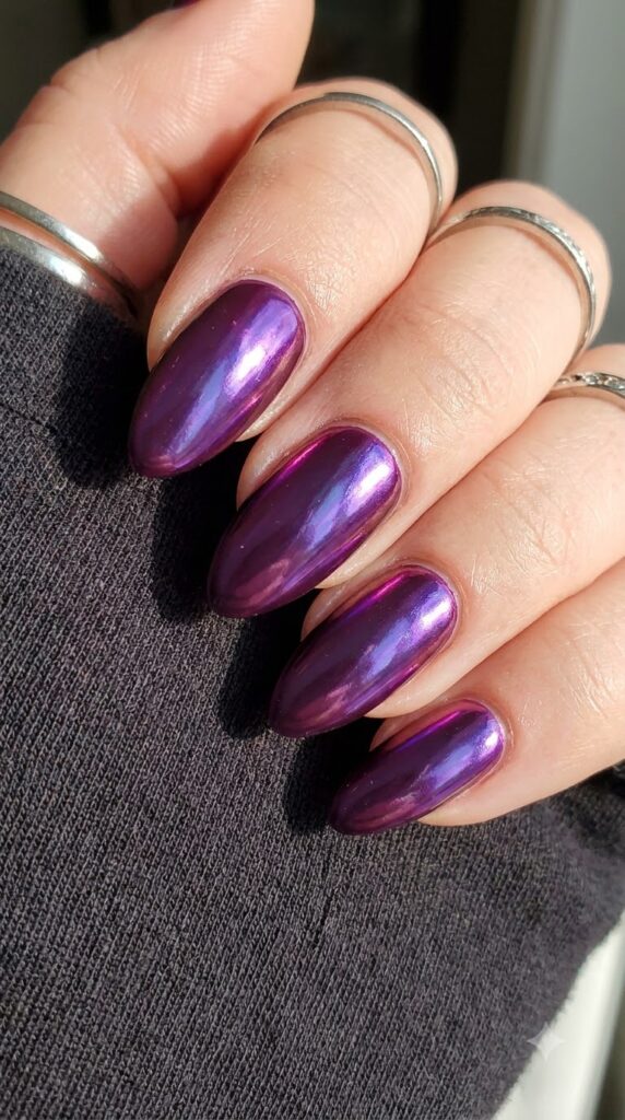 Almond deep plum purple nails buffed with violet mirror chrome powder