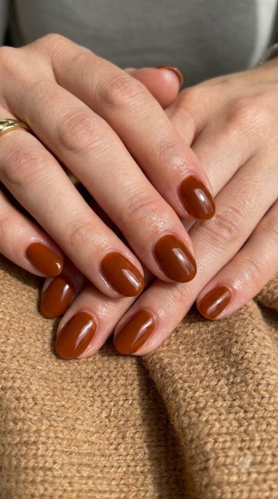 Almond nails with cream base fading smoothly into warm latte brown tips