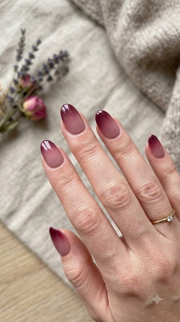 Oval muted rosewood pink nails blending smoothly into dark berry tips