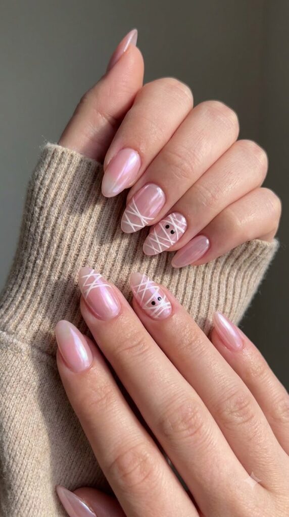 Almond glazed pink chrome nails with fine white mummy wrap lines
