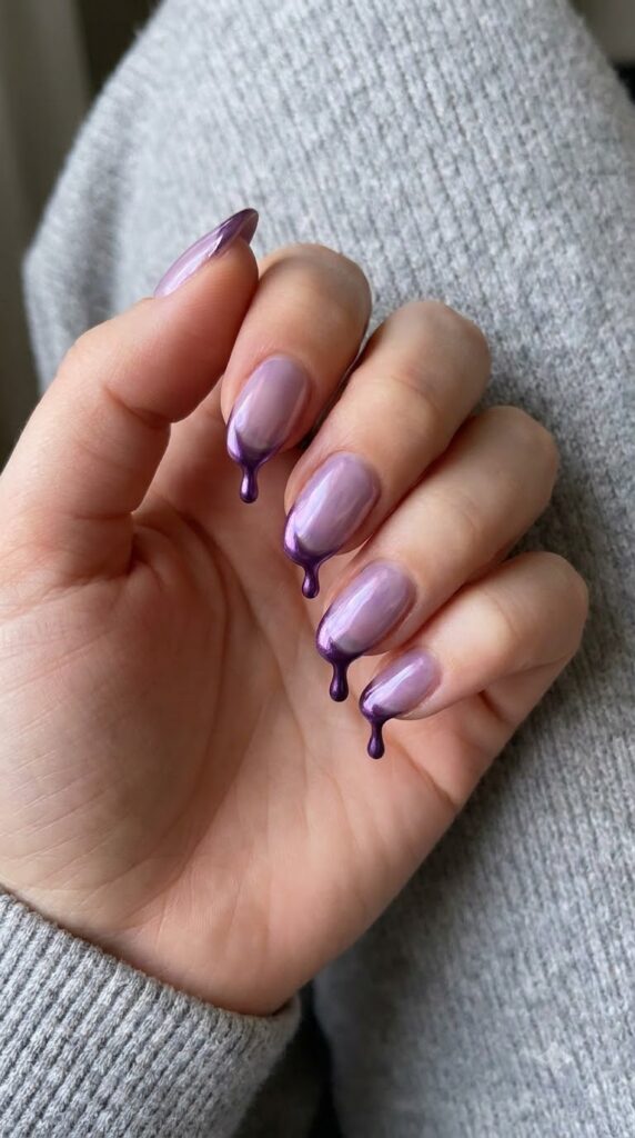 Short almond glazed lilac chrome nails with metallic deep purple drip tips
