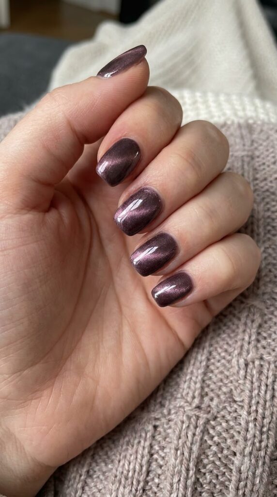 Short squoval smoky mauve nails with magnetic cat-eye velvet shimmer