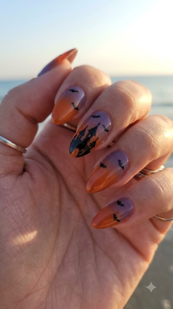 Almond orange purple gradient nails with black Cinderella castle silhouette