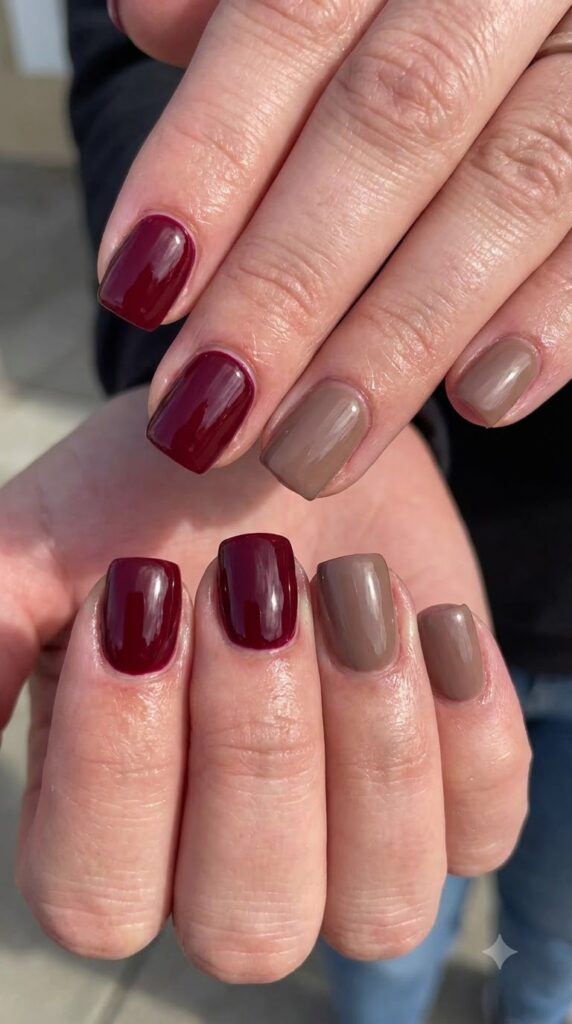 Short square nails alternating solid deep burgundy red and warm taupe