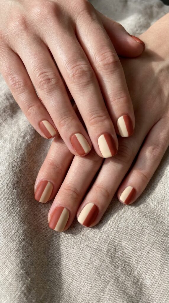 Short almond nude nails with ultra-thin deep red drips running down tips