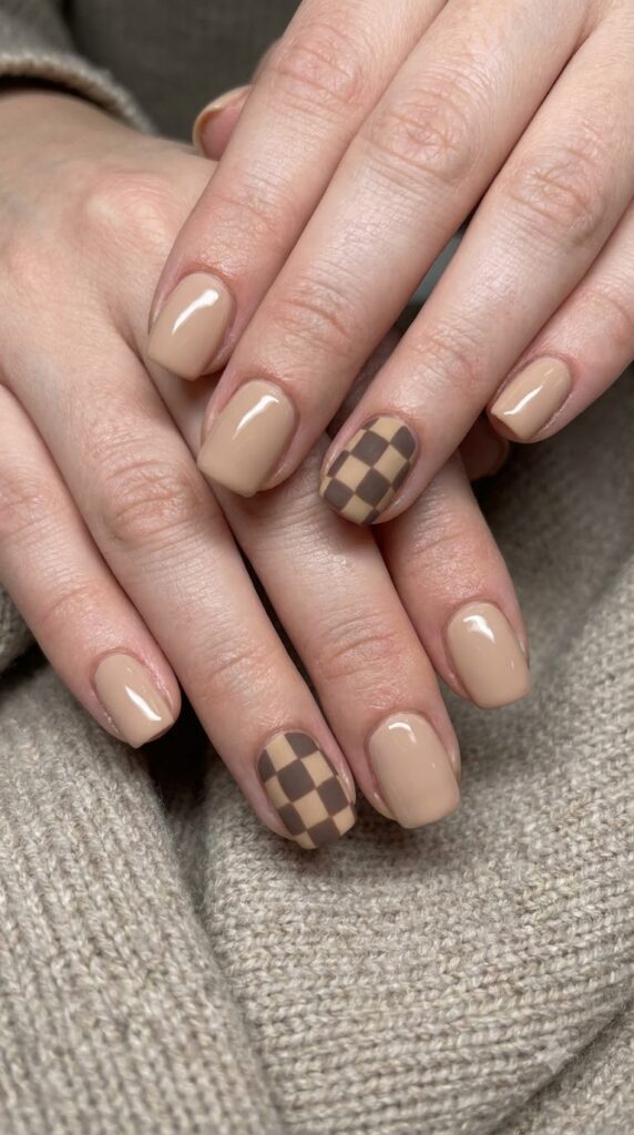 Short square nude nails with brown and tan checkerboard squares