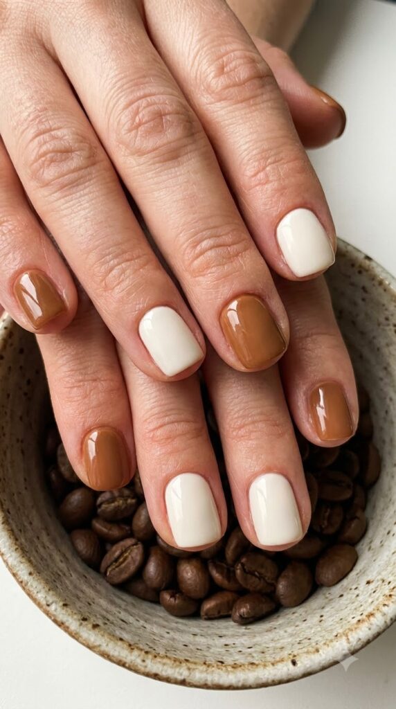 Short square nails alternating warm hazelnut brown and cream polish