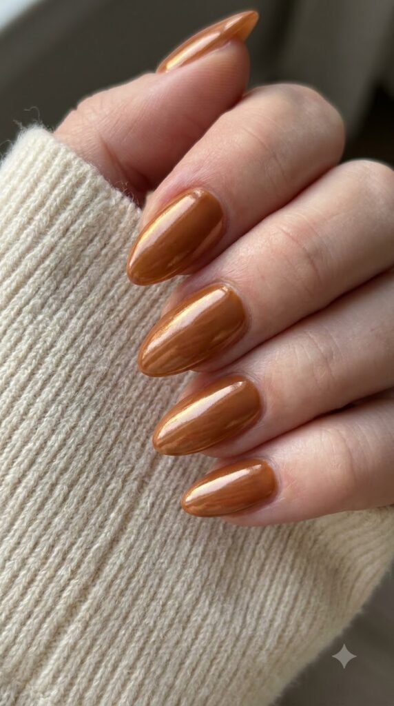 Almond maple sugar brown gel nails with high-shine glazed chrome finish