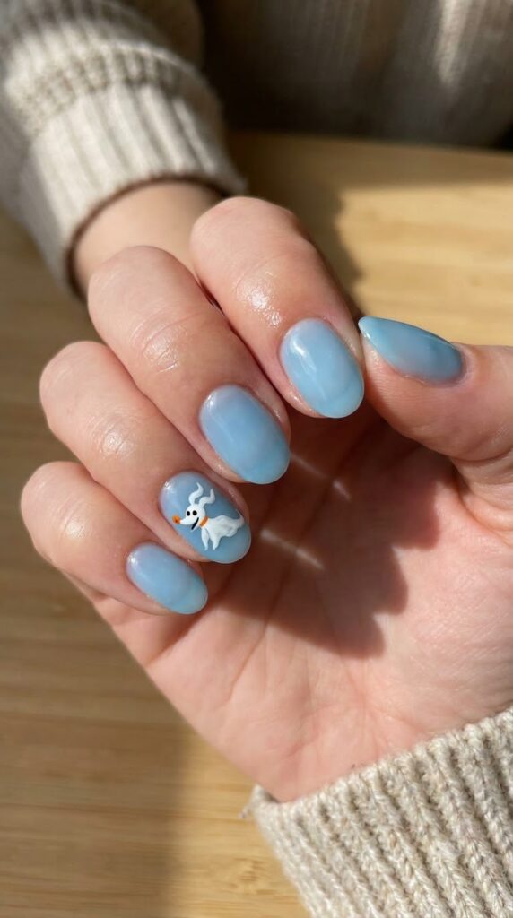 Short oval sky blue nails with floating white Zero ghost dog art