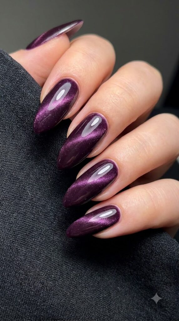 Almond deep plum purple magnetic cat-eye nails with velvety 3D shimmer