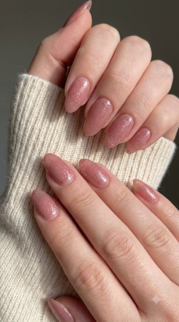 Medium almond dusty rose pink nails filled with fine rose gold shimmer