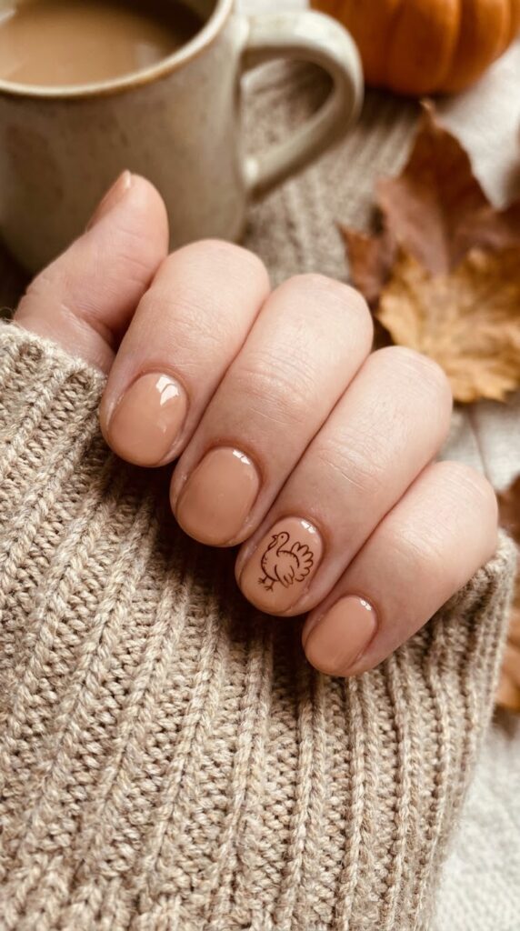 Short natural round nude nails with a miniature painted turkey outline
